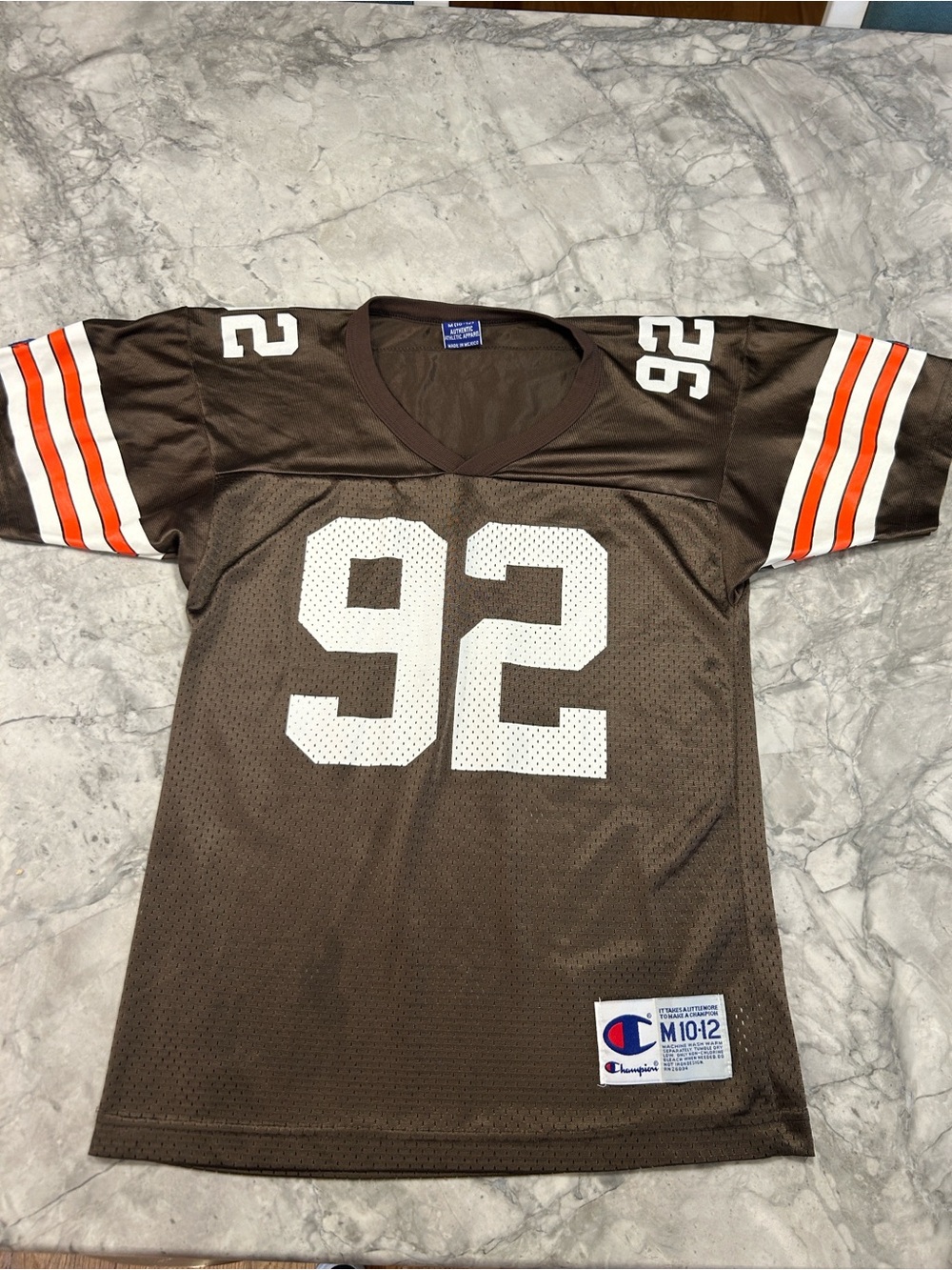 Champion kid’s Brown #92 Football Jersey with Orange & White Stripes sz M10-12